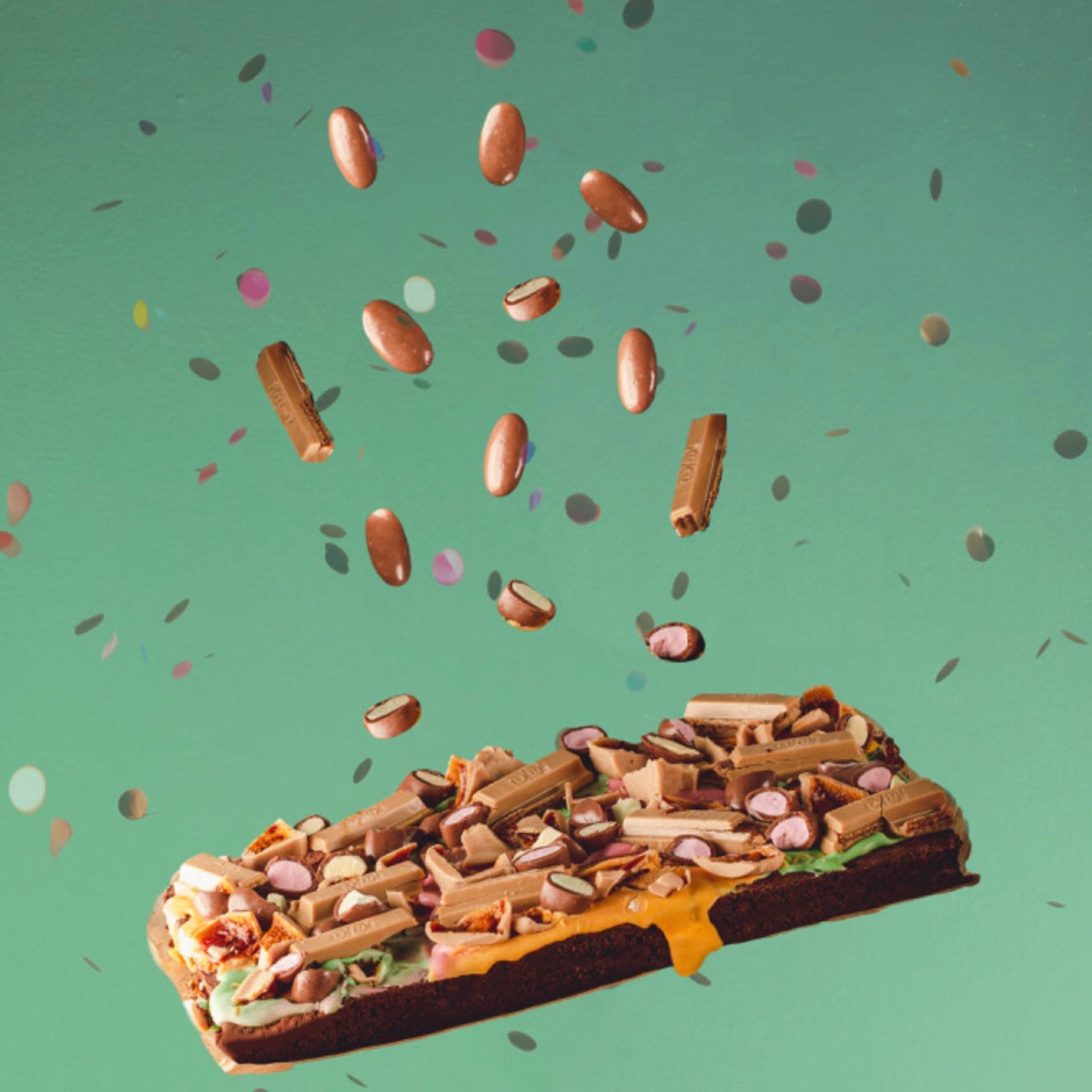 floating brownie with falling clinkers and kitkat pieces