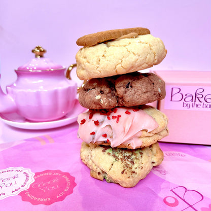4 cookies stacked high on pretty pink tissue paper and a gift box ready for delivery australia wide