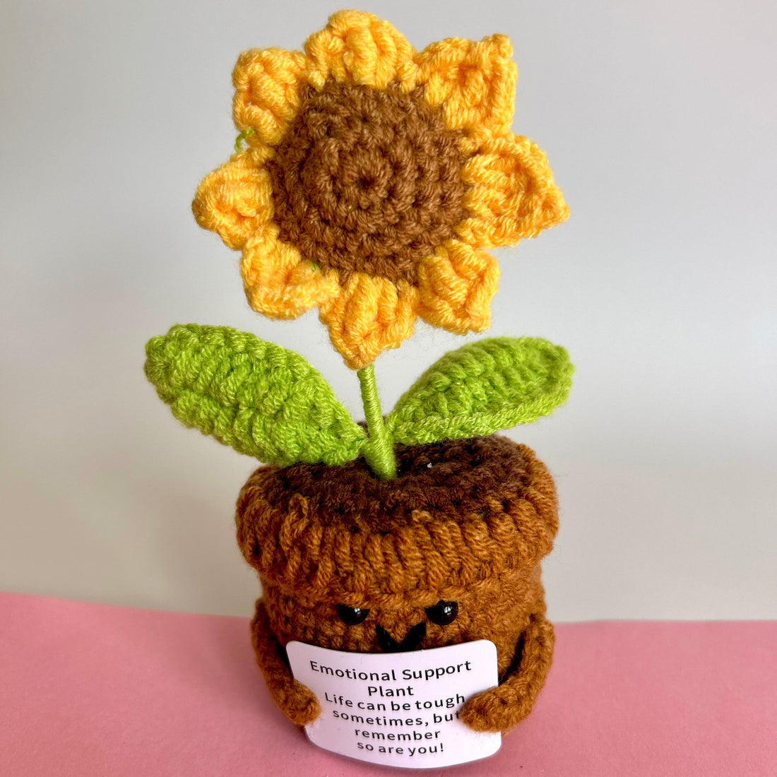 Hand knitted keepsake sunflower with message reading emotional support plant, life can be tough sometimes, but remember so are you!