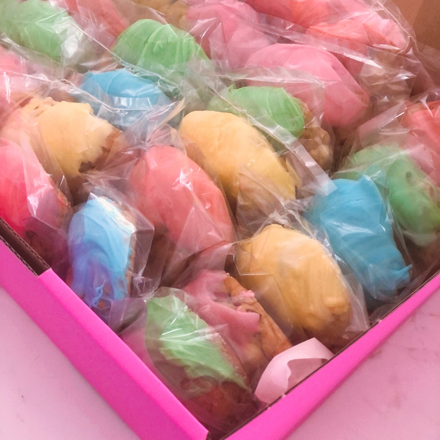 bonbonniere cookies in rainbow colors ready for a wedding or party
