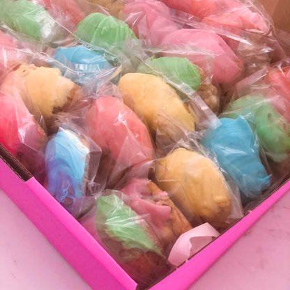 bonbonniere cookies in rainbow colors ready for a wedding or party